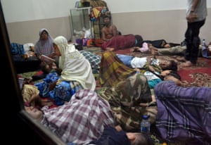 Residents sit inside a mosque after fleeing the tsunami in Labuan district in Pandeglang, one of the worst-hit areas.