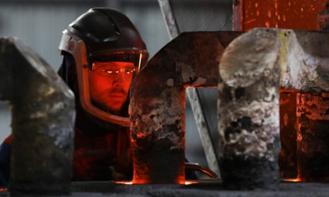 A worker at a conventional aluminium smelting facility in Fort William in the UK