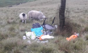 Camping debris left in the Peak District and grazing sheep nearby.