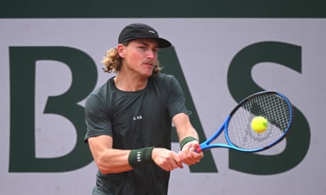 Max Purcell plays a backhand against Henri Squire of Germany