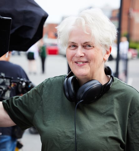 Sally Wainwright in green short-sleeved shirt and headphones