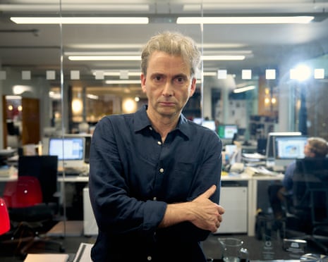 A portrait of David Tennant in a newspaper office.