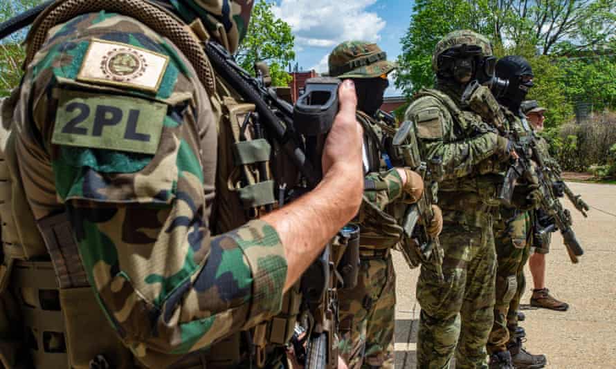 Armed members of the New England Minutemen militia group at an anti-mask and anti-vaccine ‘world wide rally for freedom’ in Concord, New Hampshire, 15 May 2021.