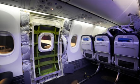 A door plug area of an Alaska Airlines Boeing 737 Max 9 aircraft taped up after the panel was blown off at 14,000ft