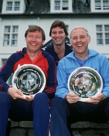 Jim McLean, right, with Alex Ferguson, the manager of Aberdeen, left, and Scotland player Martin Buchan after the presentation of awards for the promotion and teaching of football, 1985.