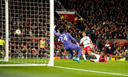 Twente’s Sam Lammers, centre, scores his side’s goal at Old Trafford