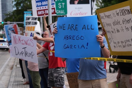 Person holding sign that says We are all Abrego Garcia.