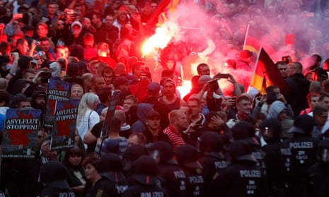 Police and protesters in Chemnitz, eastern Germany, on 27 August