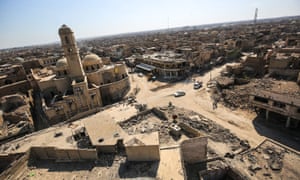 Destruction surrounding the Roman Catholic Church of Our Lady of the Hour (L) in the old city of Mosul