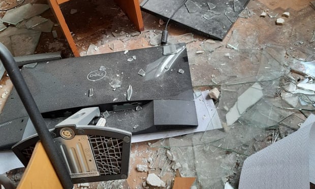 Smashed computer equipment on the floor