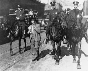 Mounted police round up African Americans and escort them to a safety zone during the Chicago Race Riot of 1919.