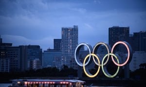 A Japanese houseboat sails past the Olympic rings in Tokyo on Friday