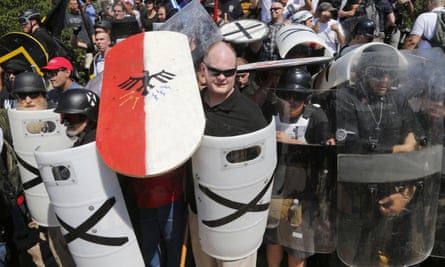 White nationalist demonstrators use shields as they guard the entrance to Lee Park in Charlottesville, Virginia.