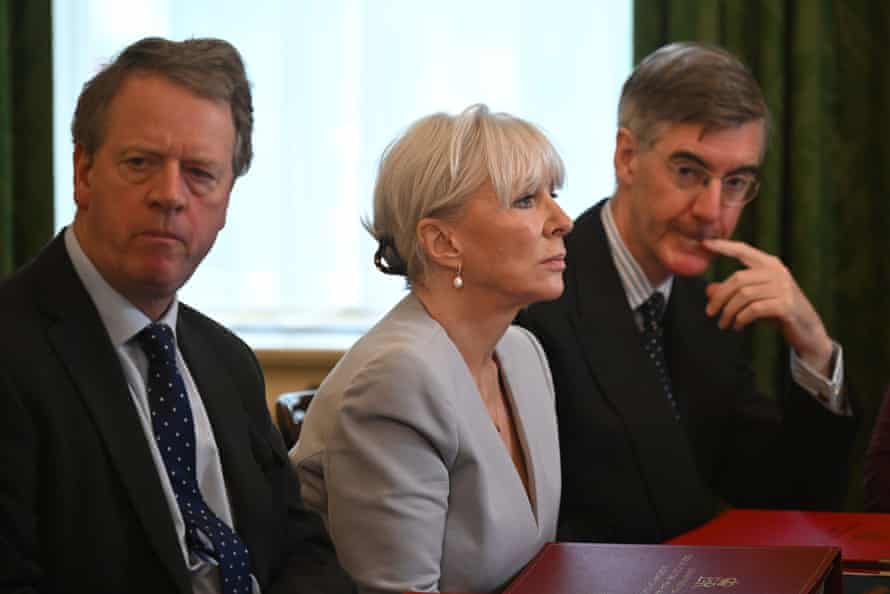 Alister Jack, the Scottish secretary, Nadine Dorries, the culture secretary, and Jacob Rees-Mogg, the Brexit opportunities minister (right) at cabinet this morning, listening as Boris Johnson addressed his ministers.