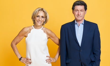 Emily Maitlis and Jon Sopel standing side by side for a studio portrait with yellow backdrop