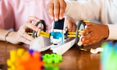 Close,Up,Of,Unrecognizable,Kids,Busy,Making,Diy,Robot,By<br>Close up of unrecognizable Kids busy making DIY robot by looking from digital tablet at home concept of Children robotic Experiment, togetherness, childhood learning and development; Shutterstock ID 2093624032; purchase_order: -; job: -; client: -; other: -
