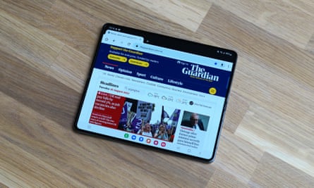 The Guardian site shown in full-size tablet view on the Z Fold 4 in landscape orientation.