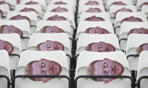 Ben Stokes masks the seats before the game.
