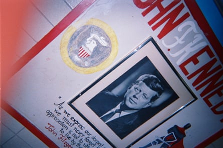 A poster of John F Kennedy in the school hallway.
