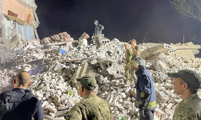 Emergency services search for survivors beneath the rubble in Chasiv Yar, Ukraine. Handout via REUTERS