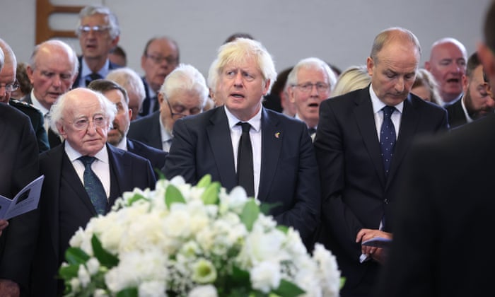 Boris Johnson attends the funeral of David Trimble with Irish president Michael D Higgins, left, in Lisburn.