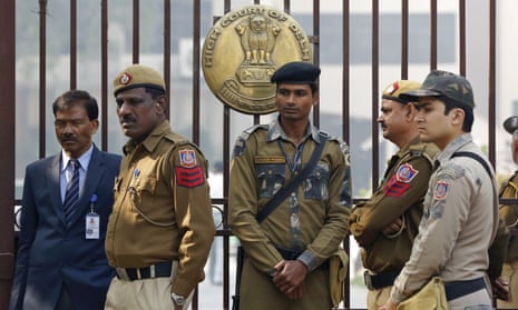 Policemen stand guard outside the high court in New Delhi.
