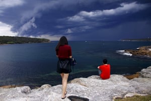 Tourists watch the storm