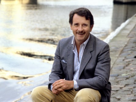 Edmund White smiling, in Paris, by the Seine, 1986