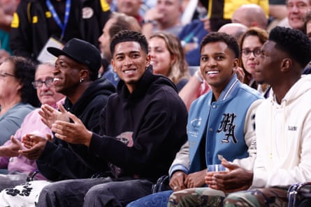Real Madrid players attend a basketball game against Barcelona in 2023.