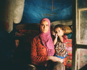 Yusra Abdullah, 23, is living in limbo with her five children in a chicken barn, unable to go home and unable to move.