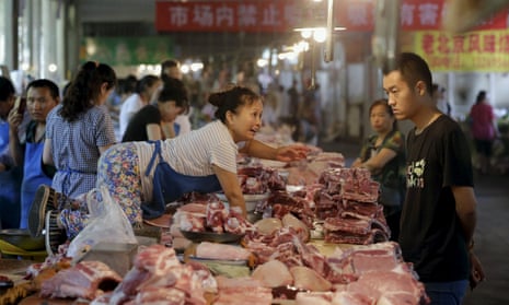 A meat vendor at a market in Beijing