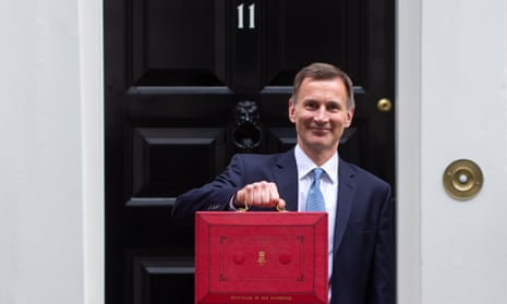 The chancellor, Jeremy Hunt, holds the red box outside 11 Downing Street before his budget announcement.