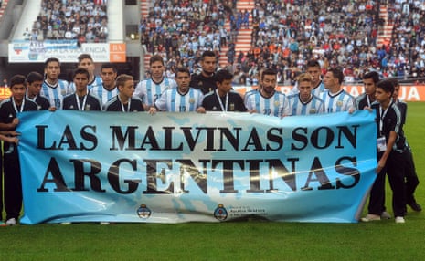 Argentina's team poses with a similar banner before an international friendly soccer match against Slovenia in La Plata, Argentina in 2014.