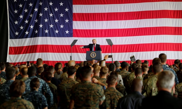 Donald Trump delivers remarks to US military personnel at naval air base in Sicily.