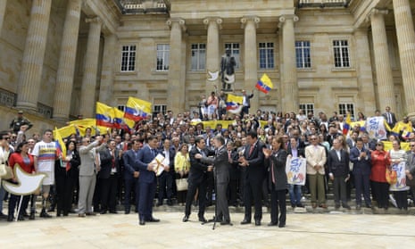President Juan Manuel Santos (centre) delivers the peace agreement with the Farc to Congress.