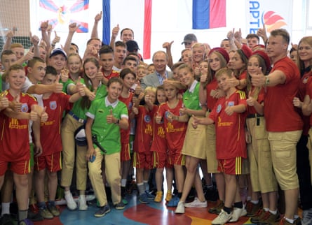 Vladimir Putin poses for a photo with children at the Artek children’s holiday camp in 2017