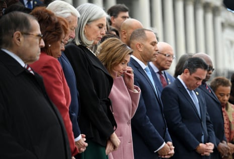Outgoing speaker of the House of Representative Nancy Pelosi (C) joins a bipartisan group of lawmakers on the east front steps of the US Capitol to honor the police officers who lost their lives in the attack on the Capitol, on the second anniversary of the January 6, 2021 attack in Washington, DC, on January 6, 2023.