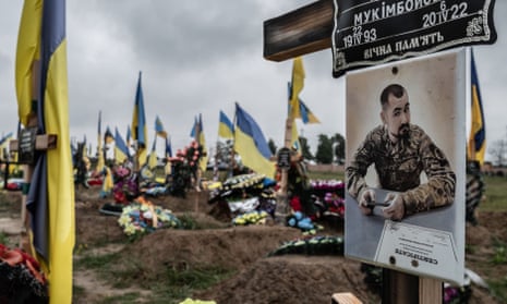 A Ukrainian serviceman’s grave in the military section of a cemetery in in the Kharkiv region, Ukraine