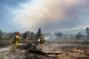 Firefighters work as the Cranston fire burns in San Bernardino national forest near Idyllwild.