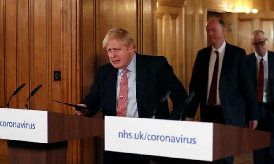 Boris Johnson arrives at a news conference on 12 March.