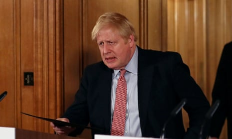 The UK prime minister, Boris Johnson, arriving at a coronavirus press conference. 