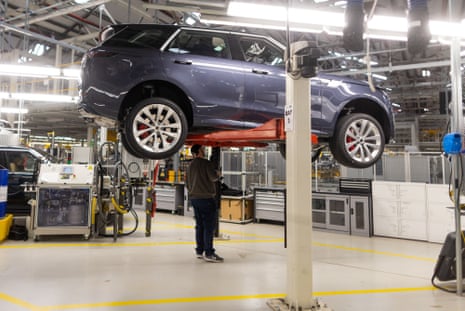 Employees check a Range Rover at JLR’s Solihull plant. Trump’s import taxes had threatened to cripple British high-end carmakers.