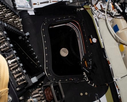 A view of the moon through the window of the Orion spacecraft.