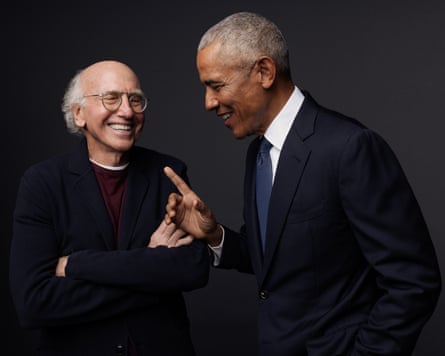 Larry David and Barack Obama laugh together, one pointing while the other’s arms are crossed