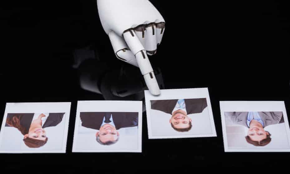 Robot hand choosing a photo of a candidate out of four headshots.