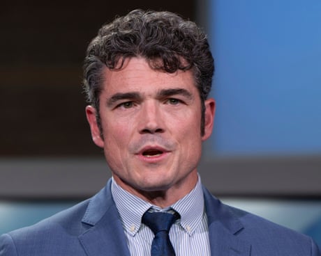 man in suit speaking