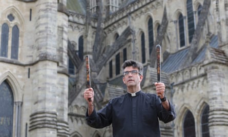 The current dean of Salisbury cathedral, The Very Revd Nicholas Papadopulos, with ornate truncheons from the Cathedral’s historic collection.