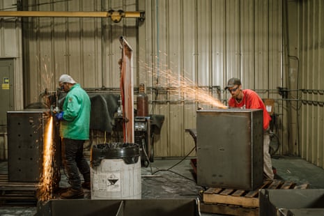 Employees smooth welds with a grinder at Lawrence Brothers, a metal fabrication company in Bluefield, Virginia, on 30 August. Lawrence Brothers mostly has fabricated equipment for mining, but is now moving into some alternative energy supplying.