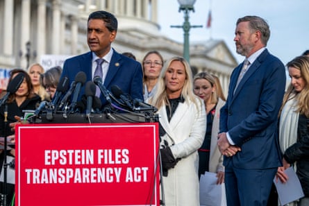 people stand outside by lectern marked ‘epstein files transparency act’