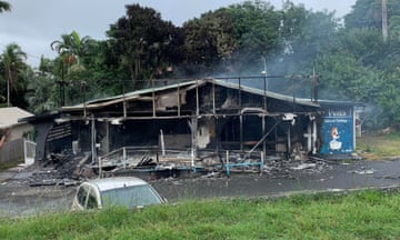 A building damaged in the New Caledonia riots against plans to allow more people to take part in local elections